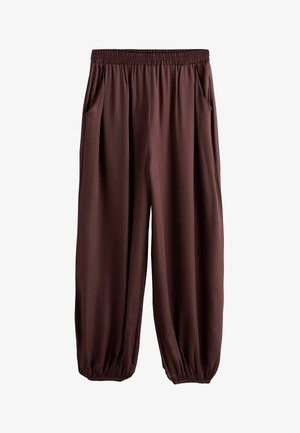 Brune løstsiddende bukser med elastisk talje og manchetter, sidelommer, lavet af glat stof.