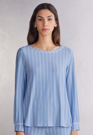 Lichtblauw longsleeve shirt met verticale witte strepen, een ronde halslijn en elastische cuffs, vervaardigd uit gladde stof.