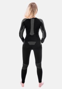 Black athletic bodysuit with long sleeves and form-fitting design, featuring grey panel accents and textured stretch fabric.