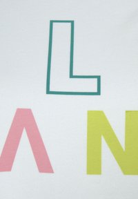 White fabric featuring large, flat letters in pink, green, and yellow. Letters have a bold, geometric design with clean lines and no textures.