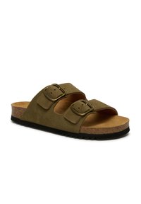 Sandales à glisser en suède vert avec deux sangles réglables, semelle en liège et semelle extérieure noire texturée. Comprend des boucles en tone bronze et une finition lisse.