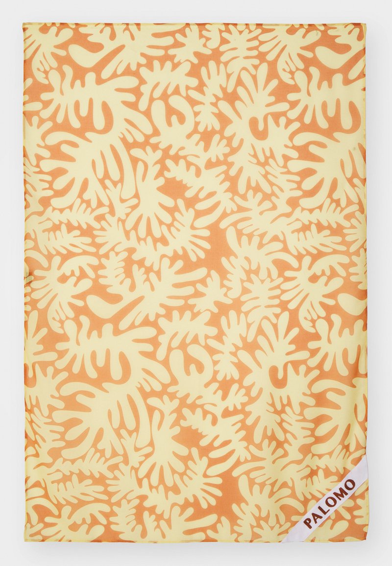 Yellow fabric with a coral-like pattern in orange and cream. Includes a white label with "PALOMO" in brown text at the bottom right corner.