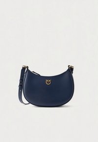 Navy leather handbag, crescent shape, with a gold-tone logo accent. Features a long adjustable strap and smooth texture.