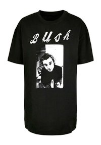 Sort bomulds t-shirt med et fremtrædende grafisk motiv af en person i sort og hvid, tekst "BUSH" i slidt skrift over billedet.