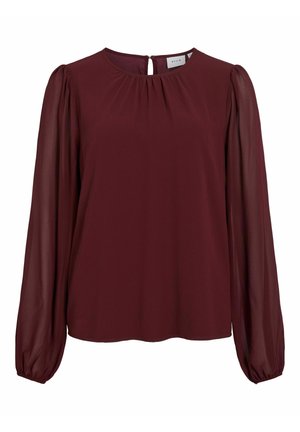 Blouse bourgogne avec de longues manches bouffantes en voile. Encolure ronde avec ouverture en forme de clé à l'arrière. Texture lisse, coupe légèrement ample.