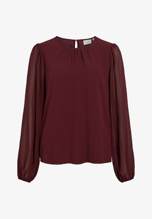 Blouse bourgogne avec de longues manches bouffantes en voile. Encolure ronde avec ouverture en forme de clé à l'arrière. Texture lisse, coupe légèrement ample.
