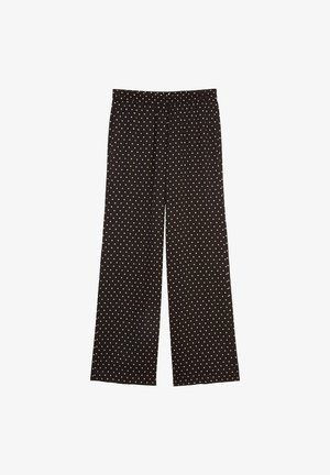 Zwarte wijde broek met witte stippen, voorzien van een elastische tailleband en een gladde stofstructuur. Geschikt voor casual kleding.