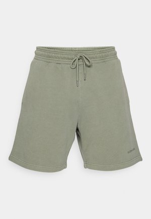 Grågrønne bomullsshorts med elastisk midje, snordetalj, sidelommer og sydde kanter. Rent design med minimal merking.