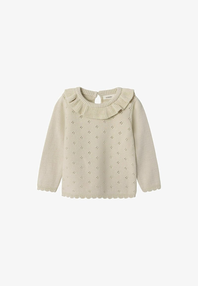 Adīts džemperis bālā bena krāsā ar viļņotu apkakli, piedāvājot nelielas caurumiņas raksta veidā, kā arī viļņotu apakšmalu un piedurknēm. Pogāma aizdare aizmugurē.