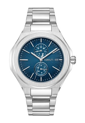 Reloj de acero inoxidable plateado para hombres con un dial azul texturizado, complicaciones de fecha y día, y marcadores de hora plateados. Cuenta con una pulsera de eslabones.