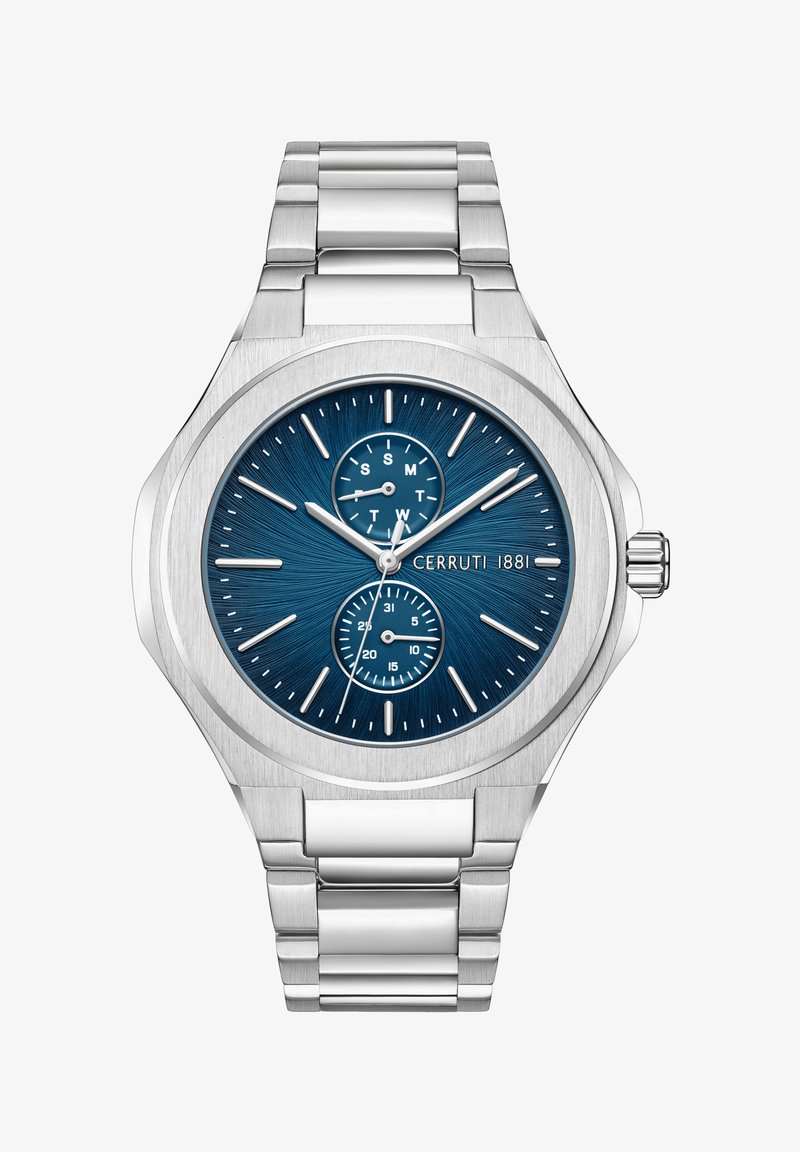 Vīriešu sudraba nerūsējošā tērauda pulkstenis ar teksturētu zilu ciparnīcu, datuma un dienas komplikācijām, kā arī sudraba stundu marķieriem. Iekļauts saites aproce.