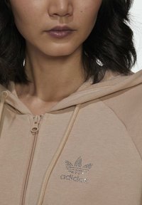 adidas Originals Majica s kapuljačom i patentnim zatvaračem - beige