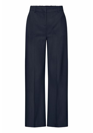 Un pantalon large bleu marine présente un tissu lisse avec une texture subtile, une taille haute et des plis avant pour un look soigné.