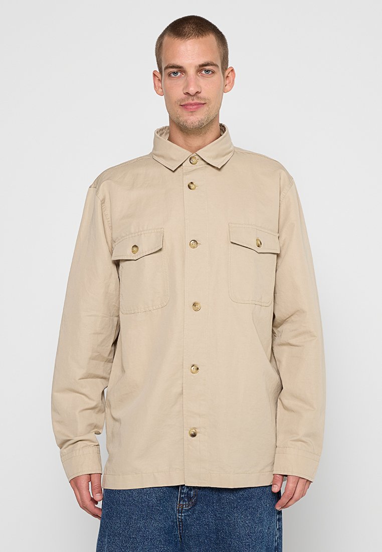 Tommy Hilfiger Lichte jas zandkleur