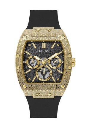 Πολυτελές ρολόι Guess με υφή, τετράγωνη κάσα σε χρυσό τόνο, μαύρο καντράν, τρεις μικροκαντράν, χρυσά δείκτες και μαύρο λουράκι από σιλικόνη.