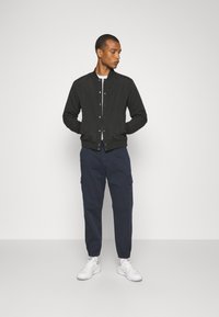 Jack & Jones WARRIOR COLLEGE UNISEX - Bomberjacka - black