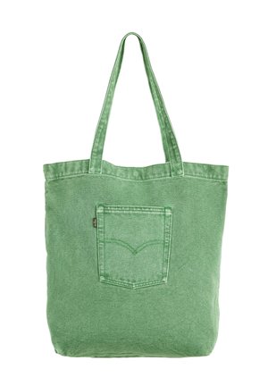 Zielona torebka na ramię z denimu z długimi rączkami i przeszytą kieszenią z przodu, zaprojektowana do codziennego użytku i noszenia codziennych przedmiotów.