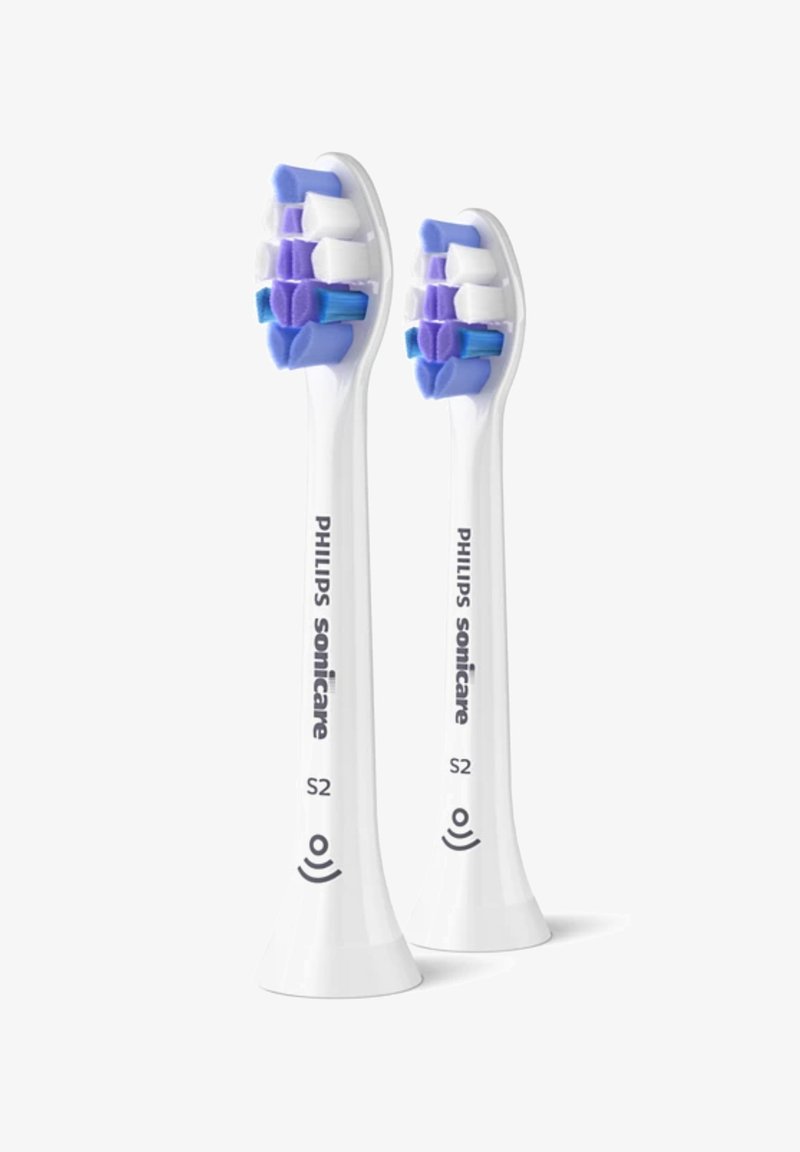 Sonicare tandborstelkoppen in het wit met blauwe en paarse haren van verschillende texturen. Twee tandborstelkoppen worden weergegeven, gemarkeerd als "S2."