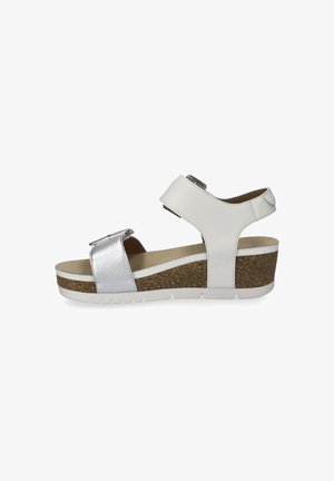 Wedge sandal with a white leather upper, silver accent strap, and a cork-textured platform. Features an adjustable buckle and rubber sole.