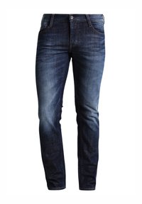 Mörkblå denimjeans med rak passform, blekta vid knäna, femfickorsmodell och kontrasterande sömmar.