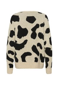 Beige džemperis ar melnu abstraktu leoparda rakstu. Ribota apakšmala un aproces. Mīksta tekstūra, brīva piegriezuma un garas piedurknes.
