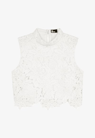 Sleeveless white lace crop top with floral patterns, high collar, and back zipper from The Kooples brand.