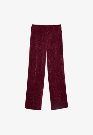 Pantalons larges bordeaux en velours, avec une surface texturée, coupe droite et poches latérales. Pas de fermetures visibles.