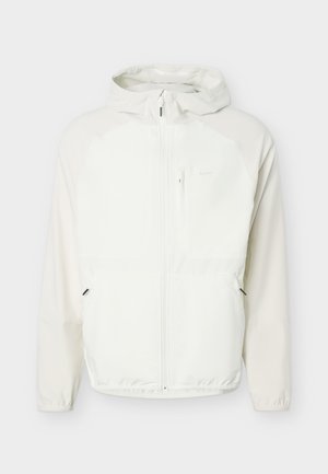 Nike Performance, UNLIMITED UTILITY - Windbreaker - light orewood/sail