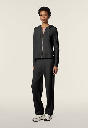 Freddy WENEA - Pantalones deportivos - black