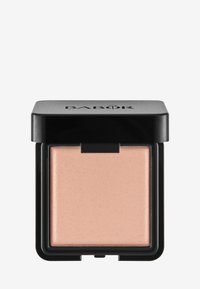 Illuminateur compact Babor dans un boîtier carré noir mat, avec un produit scintillant rose clair lisse à l'intérieur.