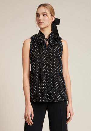 BALI - Button-down blouse - nero/pois panna