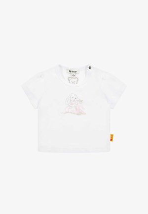 T-shirt en coton blanc à manches courtes, featuring une illustration de chien brun clair et des accents roses. Inclut une étiquette sur le côté et une fermeture à bouton.