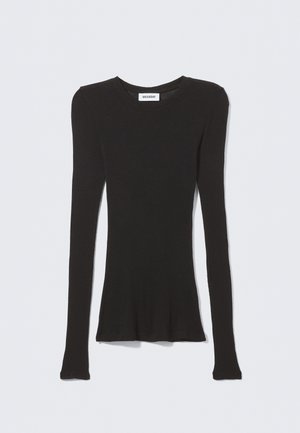 Μαύρο μακρυμάνικο τοπ από απαλό ύφασμα, με στρογγυλή λαιμόκοψη και εφαρμοστή σιλουέτα. Άκοπα μανίκια και ελάχιστο λογότυπο.