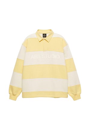 Tricou polo cu mâneci lungi, dungi galbene și albe, cu guler și text brodat "ART STUDIO Creative Department." Textură moale a țesăturii.