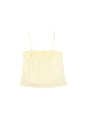 Camisola de seda color crema con finas tiras de espagueti y borde de encaje en el borde superior.