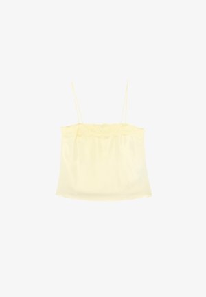 Seidiges, cremfarbenes Camisole mit dünnen Spaghetti-Trägern und Spitzenbesatz am oberen Rand.