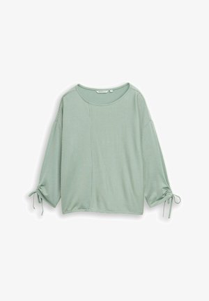 Heleroheline lühike ülaosa, mis on valmistatud soonikust kangast; sisaldab nii ühtlast kui triibulist mustrit, ümar kaelus ja seotud varruka detailid.