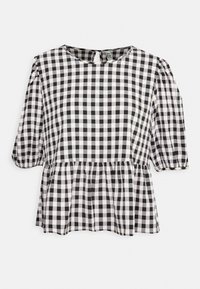 Blouse vichy noir et blanc à manches courtes bouffantes, encolure arrondie et ourlet péplum, avec un détail œillet dans le dos.