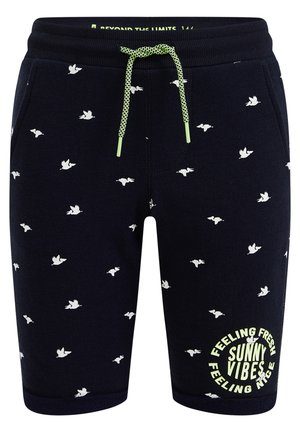 Granatowe szorty z białym wzorem latających ptaków, limonkowo-zielonym sznurkiem i napisem "Czuję się świeżo, słoneczne wibracje, czuję się dobrze" na lewej nodze.