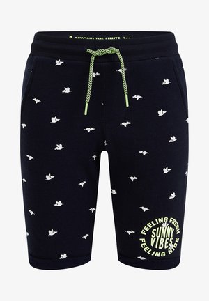 Granatowe szorty z białym wzorem latających ptaków, limonkowo-zielonym sznurkiem i napisem "Czuję się świeżo, słoneczne wibracje, czuję się dobrze" na lewej nodze.