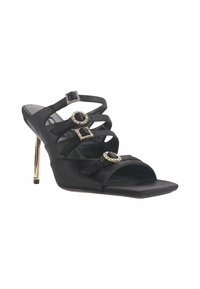 Black satin high-heeled sandal with multiple crossing straps, embellished with square and circular gem accents, featuring a gold-tone heel.