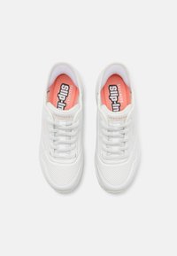 White athletic shoes with a smooth synthetic upper, perforated detailing, and a coral insole featuring "SKECHERS Slip-In" text.