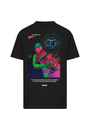 Black t-shirt featuring a colorful graphic of an astronaut, Earth, and text about the Apollo 11 mission, with vibrant neon accents.