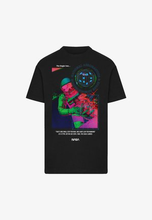 Black t-shirt featuring a colorful graphic of an astronaut, Earth, and text about the Apollo 11 mission, with vibrant neon accents.