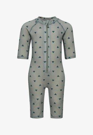Traje de neopreno gris para bebé con mangas cortas, con patrón verde parecido a un trébol y cremallera frontal que se extiende desde el cuello hasta la mitad del torso.