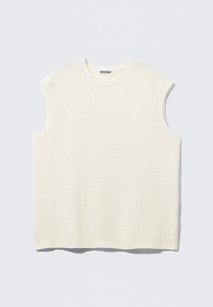 Haut sans manches en crème texturé avec des bords côtelés. Coupe ample et encolure ronde. Fabriqué à partir d'un tissu doux et confortable.