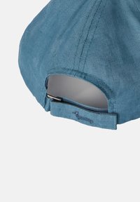 Blue linen cap with a curved brim, adjustable strap at the back, and subtle stitching details for added texture.