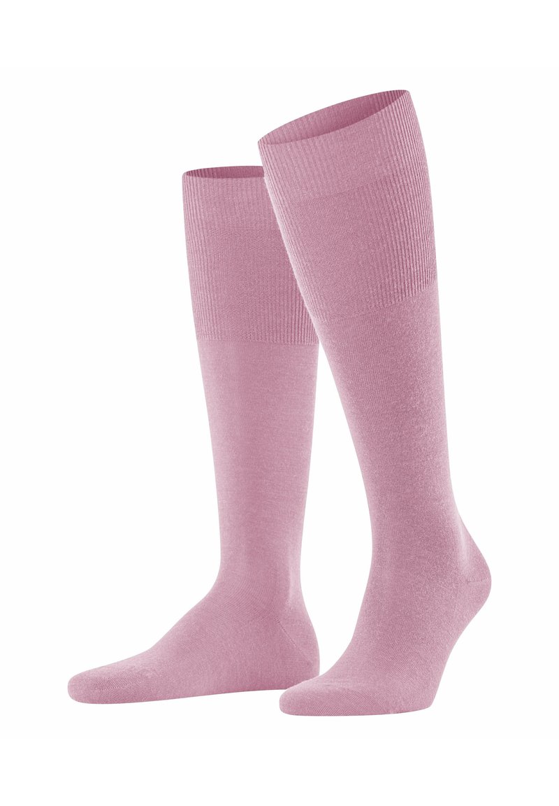 Calze a ginocchio rosa chiaro realizzate in materiale morbido ed elastico, con un design a coste nella parte superiore e un corpo liscio.