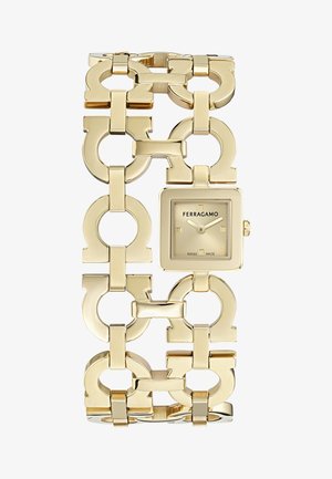 Goldfarbene Ferragamo-Armbanduhr mit quadratischem Zifferblatt und minimalistischem Ziffernblatt, verbunden durch große, markante Glieder in Kettenform.