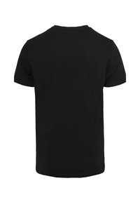 Schwarzes T-Shirt mit kurzen Ärmeln und Rundhalsausschnitt. Aus Baumwolle gefertigt, mit glatter Textur und einem einfachen, einfarbigen Design.